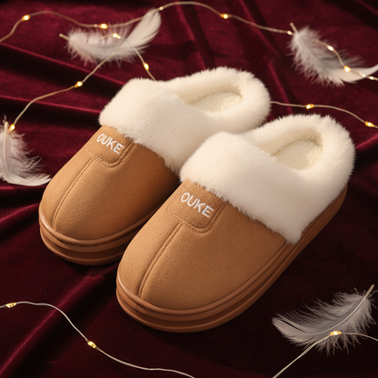 Pair of Ouke fur slippers on burgundy velvet with feathers and fairy lights